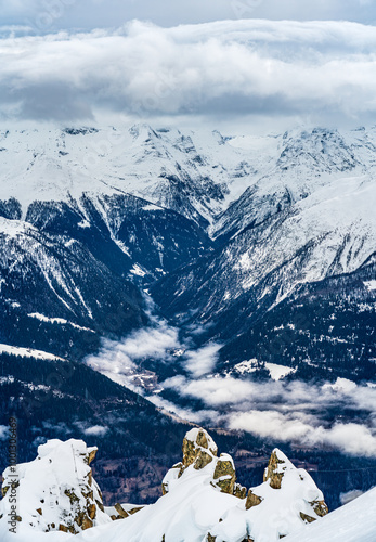 View on winter mpuntains from Eggishorn peak, Alps. photo