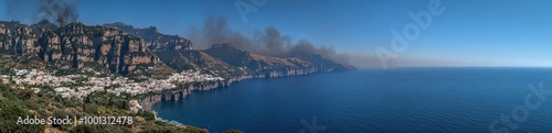 Panoramic View of Coastal Town Surrounded by Cliffs and Clear Blue Sea Under Sunny Skies Capturing Scenic Beauty and Natural Landscape