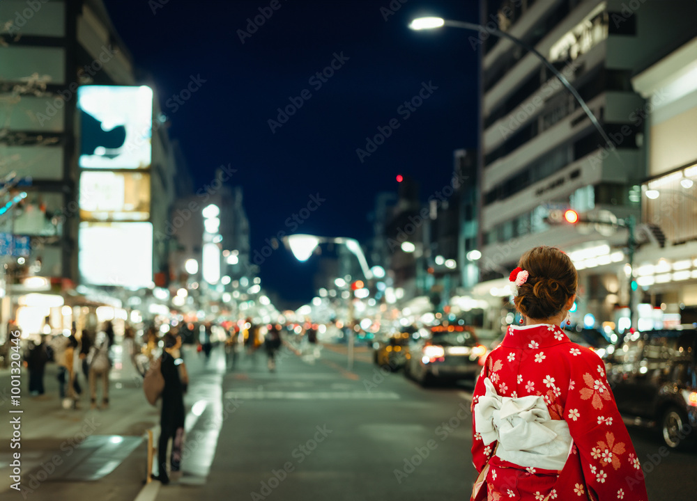 Asian girl standing out from the crowd at a city street in Japan.