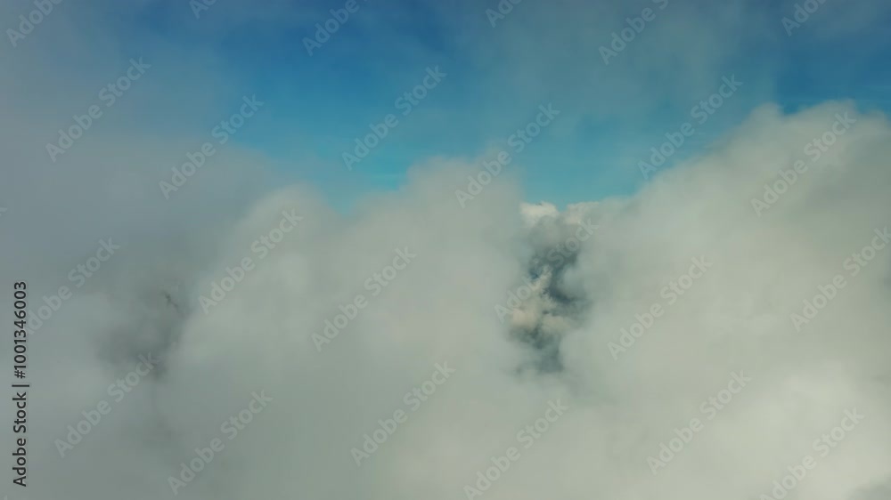 Flying through beautiful white fluffy clouds in blue sky. Airplane travel background, 4k Flying through beautiful white fluffy clouds in blue sky. Airplane travel background, 4k