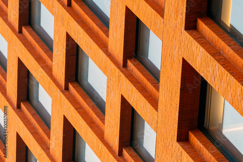 Close-up of the windows arranged in sequence on the orange building facade