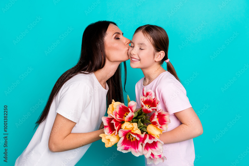 Photo of charming woman little girl presenting gift mommy mother day festive event isolated on cyan color background Photo of charming woman little girl presenting gift mommy mother day festive event isolated on cyan color background