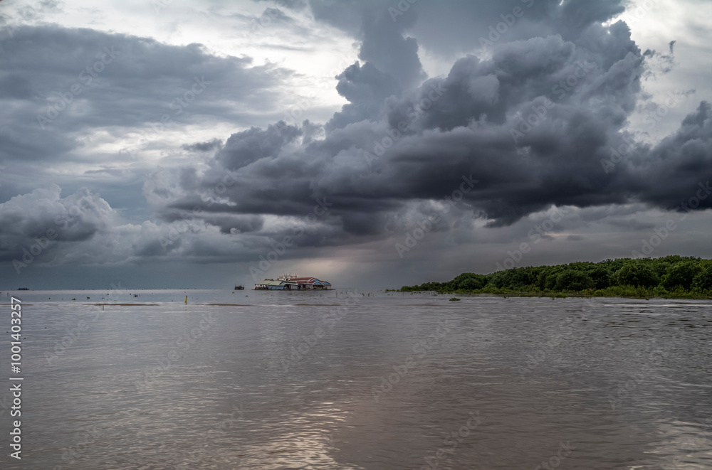 Fototapeta premium Monsoon rain clouds before a thunderstorm on the Tonle Sap lake in Cambodia