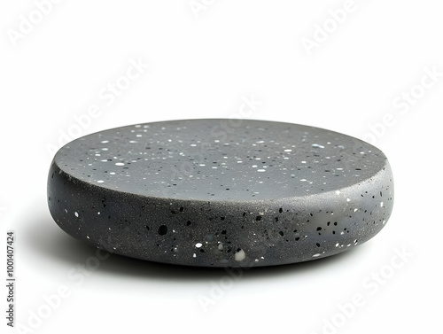 Round concrete slab, flat surface, speckled texture, isolated on white background. photo