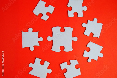 white jigsaw puzzle with missing puzzle for a text template. Above photo of isolated on the purple background