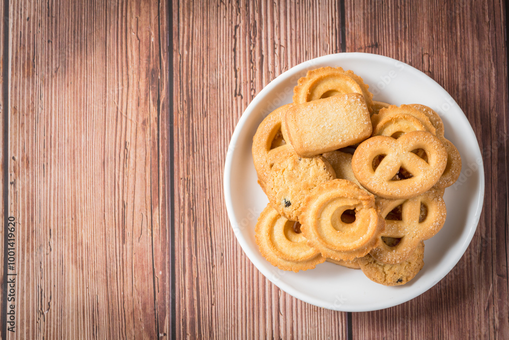 Five whole pretzel, round and rectangular shortbread biscuits with sugar on wood background. Five whole pretzel, round and rectangular shortbread biscuits with sugar on wood background.