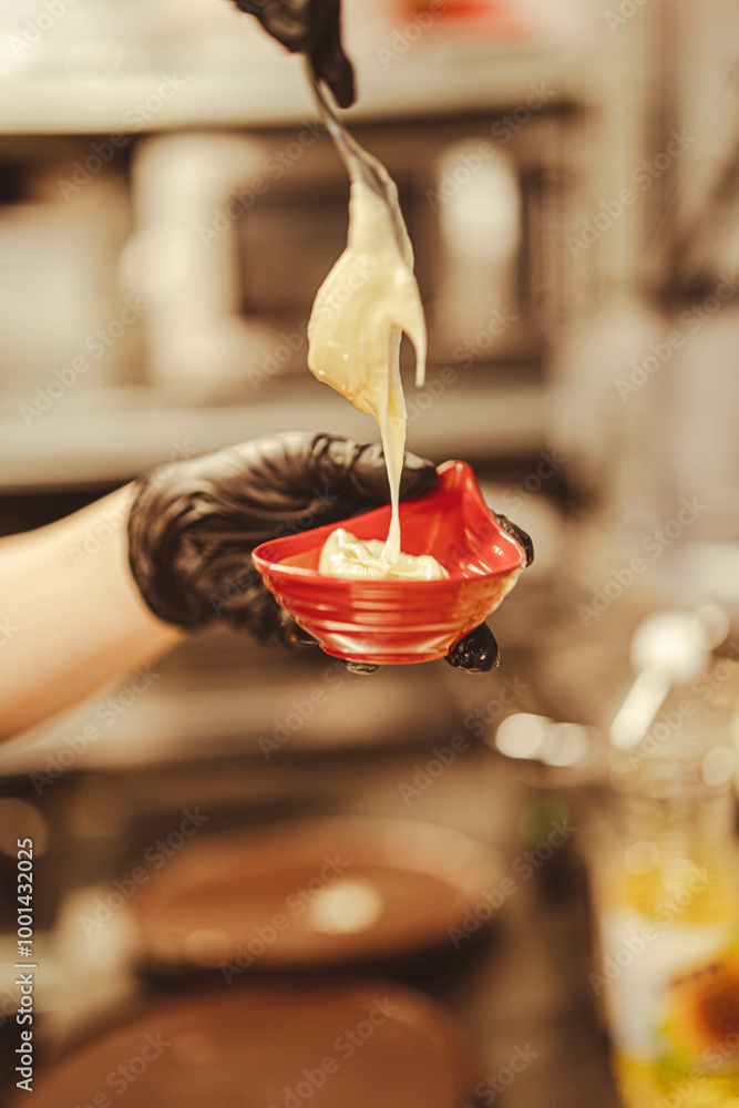 This photo captures the preparation of a delicious dessert, making it ideal for food blogs, dessert recipes, or promotions of sweet treats and dipping sauces. This photo captures the preparation of a delicious dessert, making it ideal for food blogs, dessert recipes, or promotions of sweet treats and dipping sauces.
