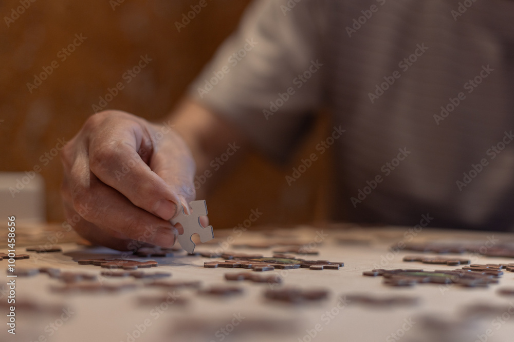 putting puzzles into a picture close-up, retired hobby putting puzzles into a picture close-up, retired hobby
