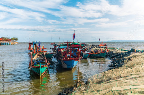 Fishing boats and crab fishing traps moored on the coast of Kep in Cambodia