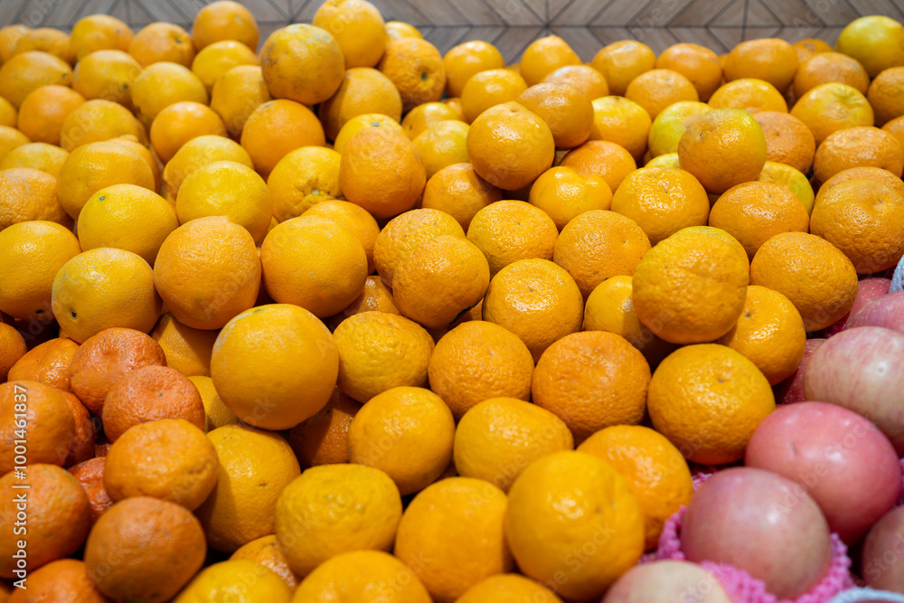 Pile of Oranges at the grocery store or fruit shop Pile of Oranges at the grocery store or fruit shop