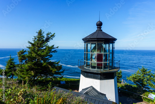 Cape Meares Lighthouse in Tillamook along the Oregon Coast overlooking the ocean photo