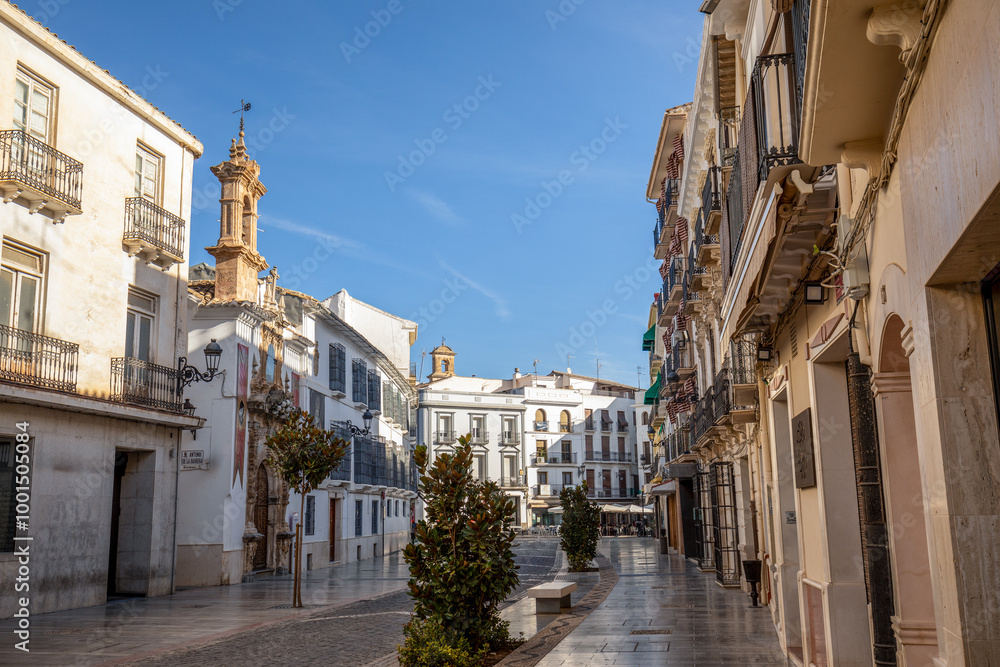 Obraz premium Famous Calle del Rio with its stately houses and the Virgen de las Angustias church in Priego de Córdoba, Cordoba, Andalusia, Spain, with nice daylight