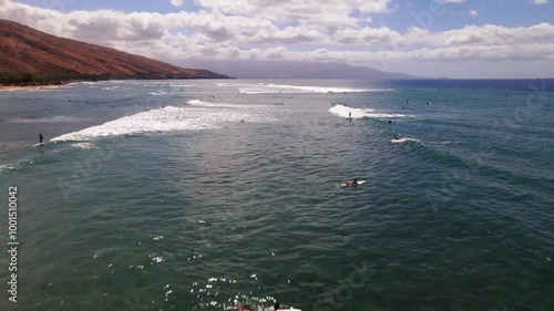 Aerial drone footage of Olowalu beach on Maui island in hawaii, USA. Reef, waves and surfers visible on a clear day photo