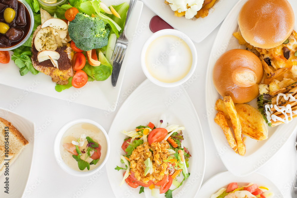 Wholesome plate of salad, burger, dressing, lettuce, bread, tomato, and cheese with a gourmet touch Wholesome plate of salad, burger, dressing, lettuce, bread, tomato, and cheese with a gourmet touch