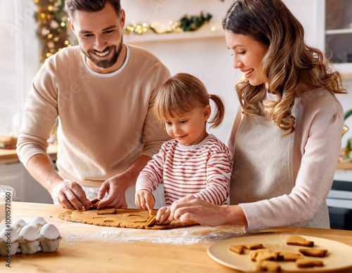 Papa, Mama und Kind beim Lebkuchen backen  photo