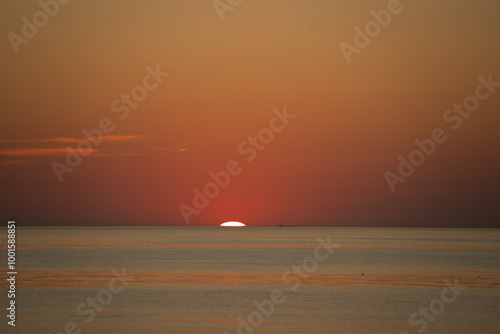 pinkish blue seawater against a pink western sky