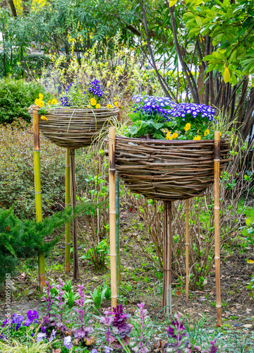 Unusual woven twig flower stands photo