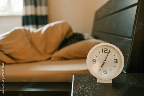 Canvas Print Alarm clock and person in the background, sleep