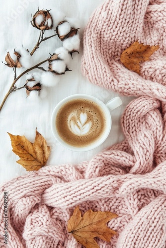 Cozy morning setting with a cup of coffee and cotton branches on a soft pink ...