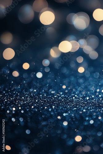 Stunning blue and gold bokeh sparkle effect created by light reflections in a...