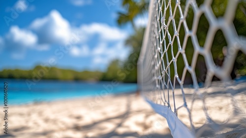 Beautiful beach with a volleyball net under a bright blue sky on a sunny day