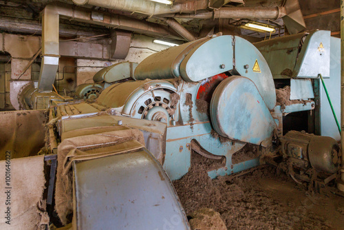 An old vintage machine in a workshop for the production of felt boots. photo