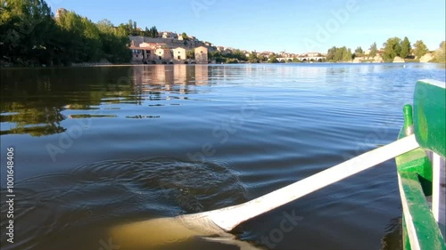 Close-up of an oar and a boat on the Duero River with the city of Zamora in the background, Zamora, Spain