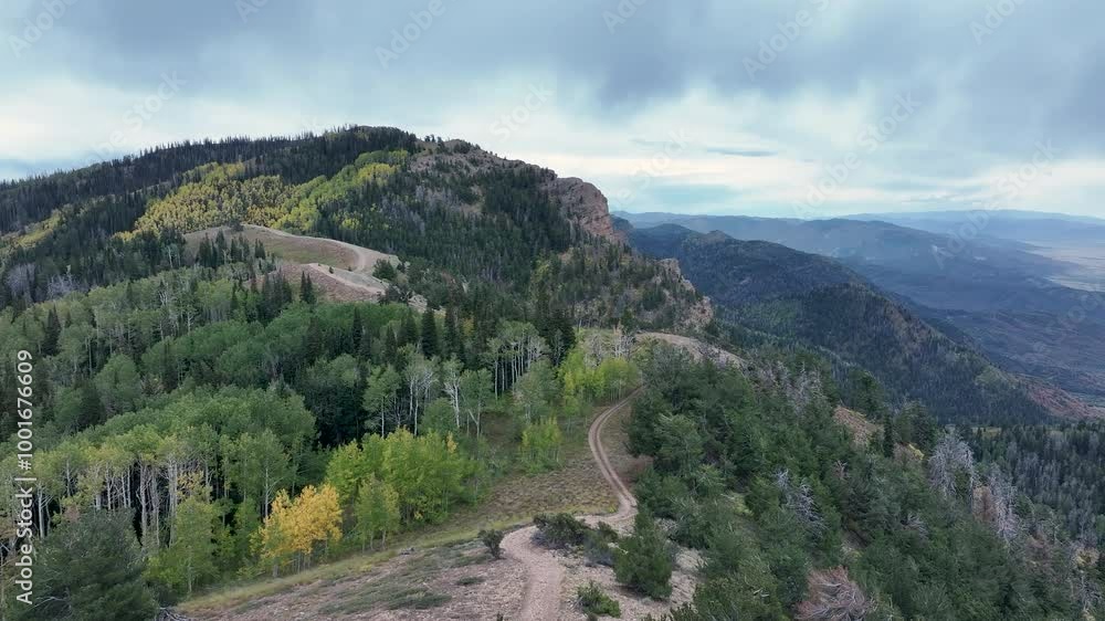 Aerial high mountain trail early autumn colors fast. Driving dirt trail mountain sport utility vehicle, UTV. Autumn fall season. Utah POV. Off road recreation sports exploring. Aerial high mountain trail early autumn colors fast. Driving dirt trail mountain sport utility vehicle, UTV. Autumn fall season. Utah POV. Off road recreation sports exploring.