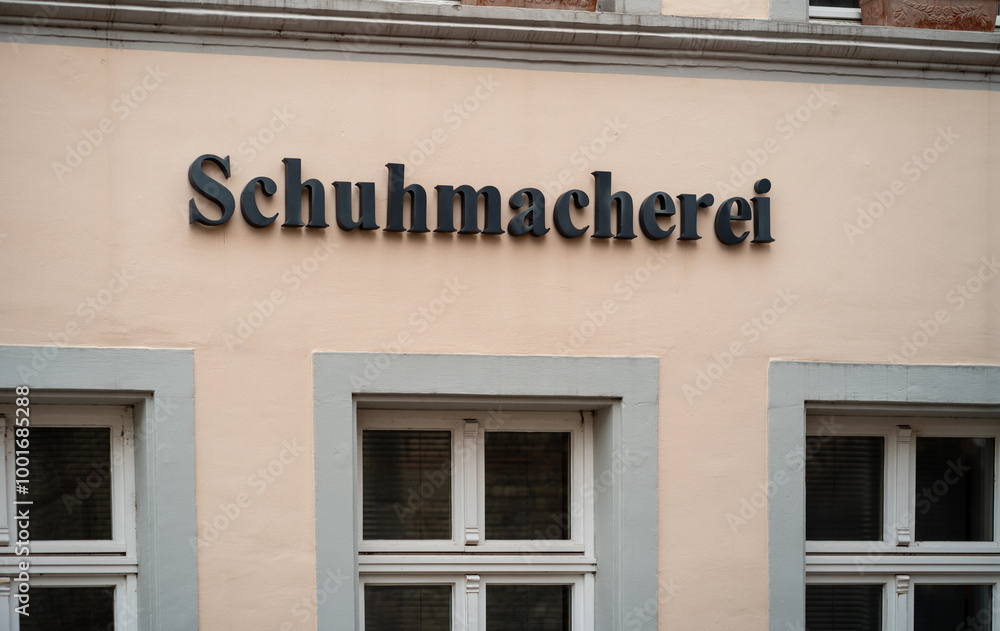 Schumacherei Schriftzug an einem Handwerkergeschäft für Schuhe. Schumacherei Schriftzug an einem Handwerkergeschäft für Schuhe.