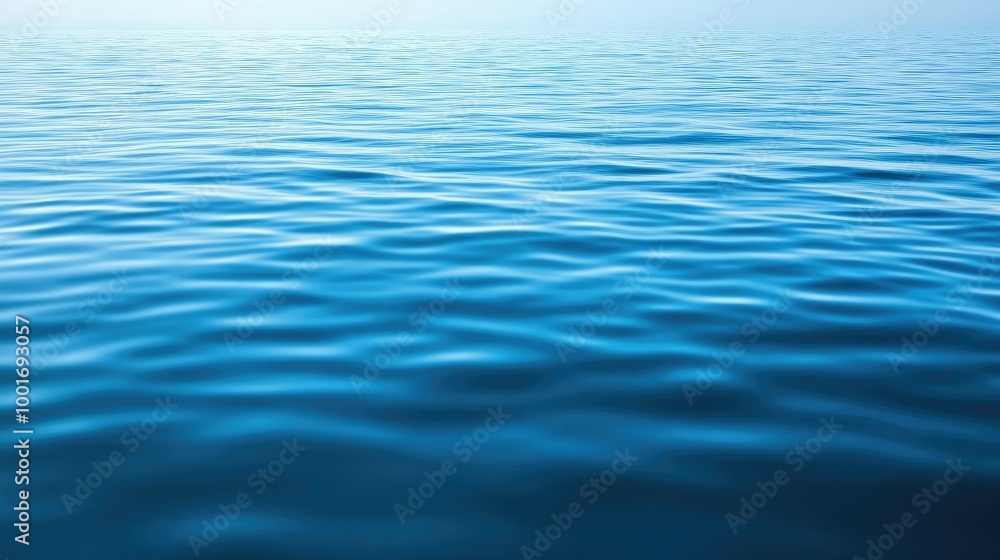 A close-up shot of the calm blue ocean water with ripples on the surface. A close-up shot of the calm blue ocean water with ripples on the surface.
