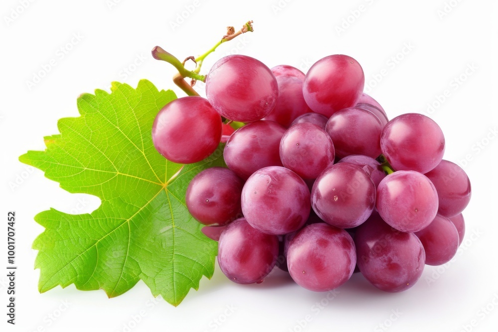 Fototapeta premium Closeup of a Bunch of Red Grapes with a Green Leaf