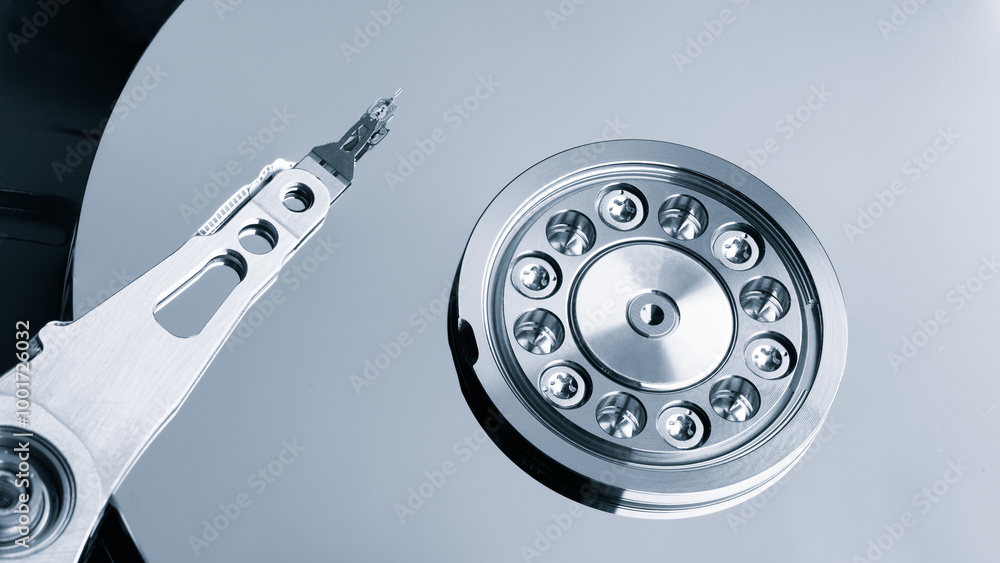 Part of a open harddisk. Disassembled hard drive from the computer, hdd with mirror effect. Opened hard drive from the computer hdd with mirror effects. Part of computer pc, laptop Part of a open harddisk. Disassembled hard drive from the computer, hdd with mirror effect. Opened hard drive from the computer hdd with mirror effects. Part of computer pc, laptop