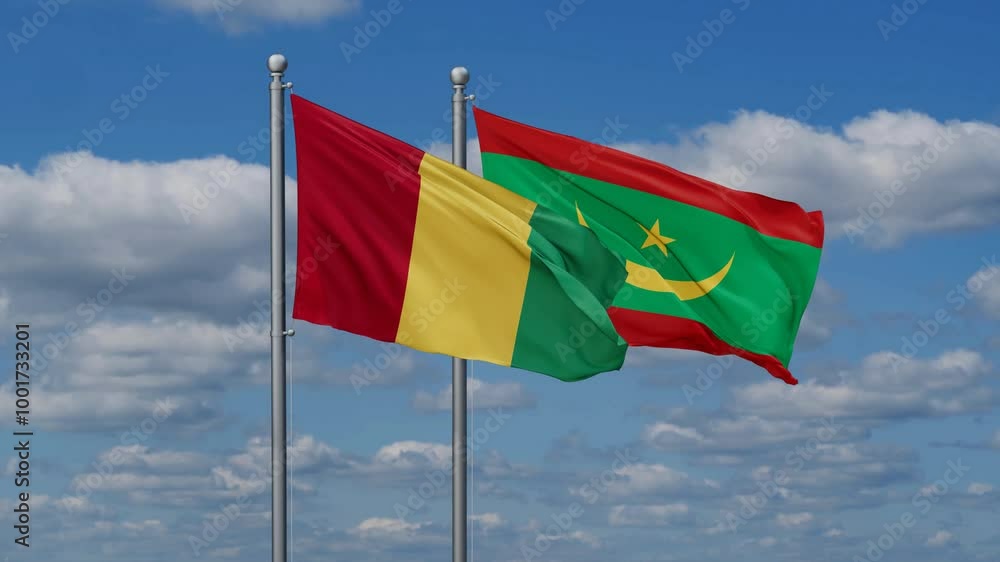 Mauritania and Guinea Conakry flags flying together, video concept of the relationship, two country relations concept Mauritania and Guinea Conakry flags flying together, video concept of the relationship, two country relations concept