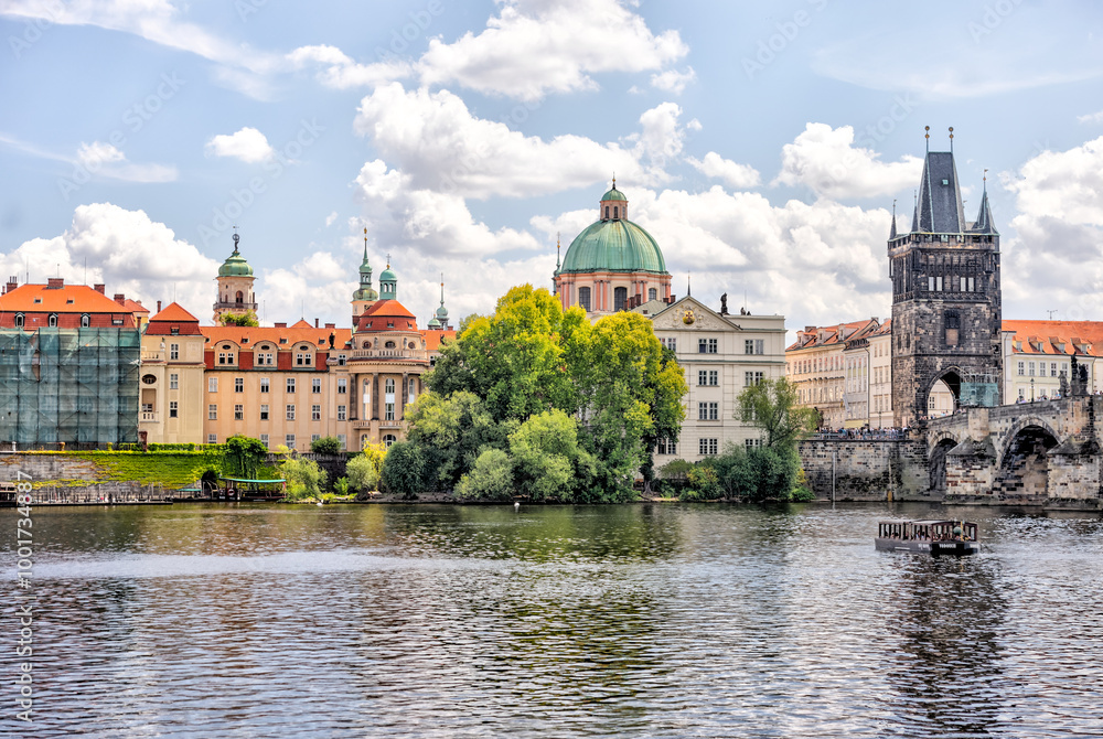 Obraz premium Prague, Czech Republic - July 19, 2024: Morning views along the Vltava River and Charles Bridge n Prague in the Czech Republic 