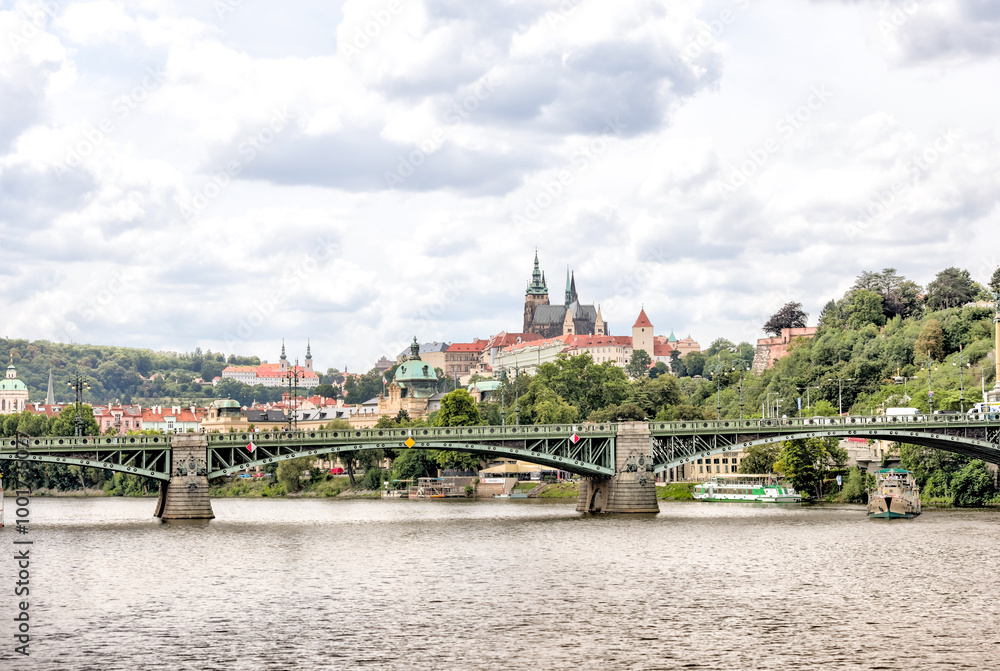 Obraz premium Prague, Czech Republic - July 19, 2024: Morning views along the Vltava River and Charles Bridge n Prague in the Czech Republic