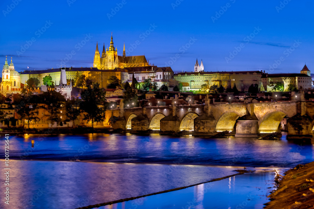 Fototapeta premium Prague, Czech Republic - July 16, 2024: Nighttime views of the Charles Bridge, Prague Castle and surrounding streets in Prague in the Czech Republic 