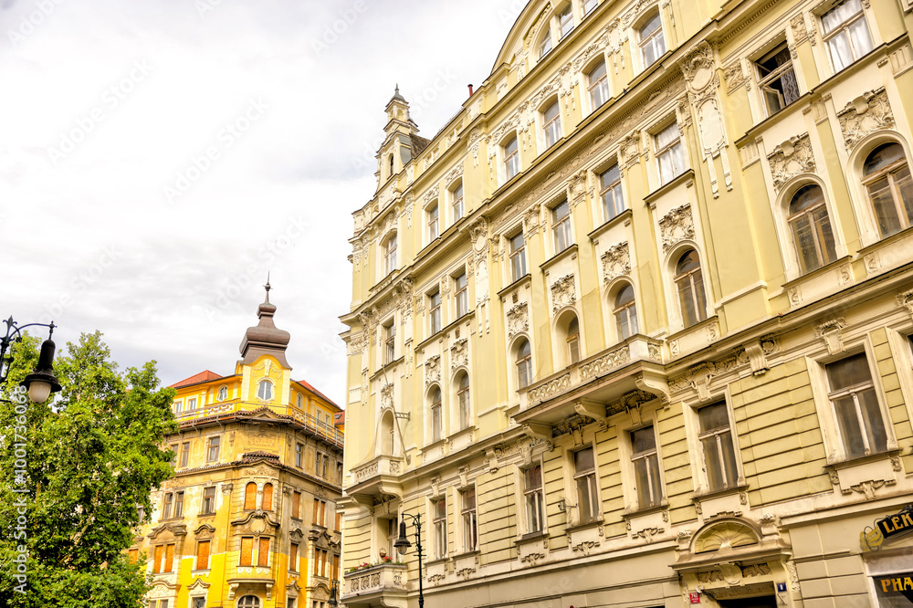 Naklejka premium Prague, Czech Republic - July 16, 2024: Classic residential buildings in the old town of Prague in the Czech Republic