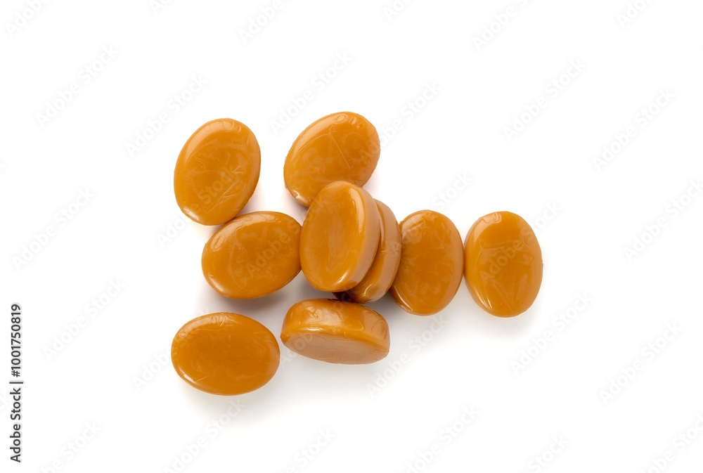 Caramel candies isolated, toffee caramel, round hard milk confectionery, brown sugar candies, small sweets Caramel candies isolated, toffee caramel, round hard milk confectionery, brown sugar candies, small sweets