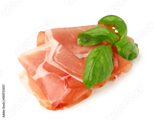 Slices of tasty prosciutto with basil on white background photo