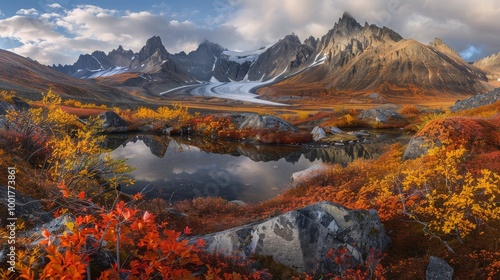 A serene mountain lake reflects the colorful autumn foliage and majestic peaks in a breathtaking scene.