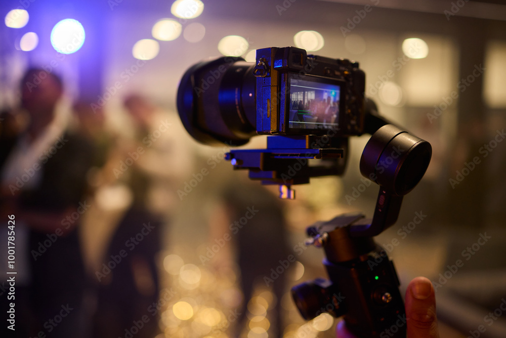 A Professional Camera Stabilizer utilized at a thriving Event setting for capturing stunning visuals A Professional Camera Stabilizer utilized at a thriving Event setting for capturing stunning visuals