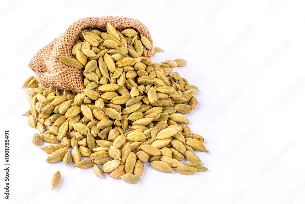 Green cardamom pods with seeds isolated on white background with copy space for text or images. Spices, food, cooking concept. Close-up shot. Green cardamom pods with seeds isolated on white background with copy space for text or images. Spices, food, cooking concept. Close-up shot.