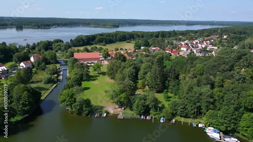 small village at lakes and forests in summer. Nice aerial view flight drone photo