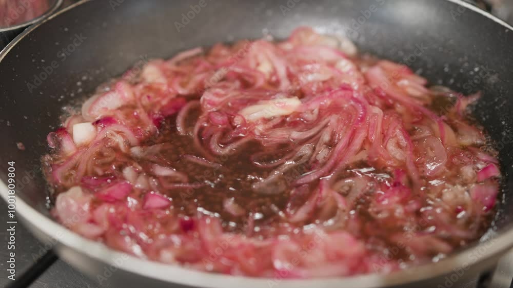 Cooking Caramelized Onion In A Non-Stick Pan In The Kitchen Cooking Caramelized Onion In A Non-Stick Pan In The Kitchen