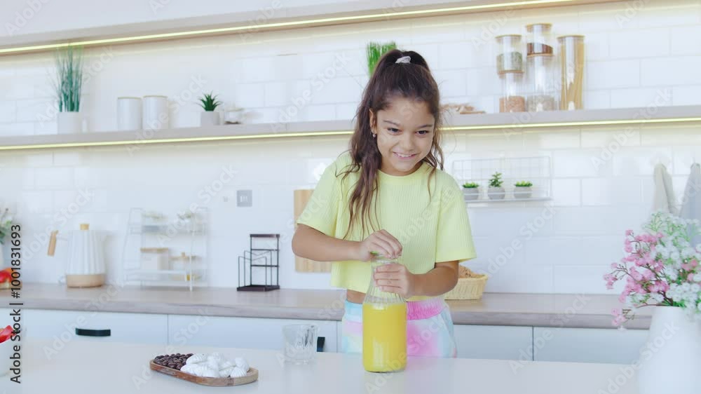 A young girl is joyfully preparing fresh juice in her bright and modern kitchen, showcasing the fun and healthy aspect of cooking while enjoying a colorful and vibrant culinary experience A young girl is joyfully preparing fresh juice in her bright and modern kitchen, showcasing the fun and healthy aspect of cooking while enjoying a colorful and vibrant culinary experience