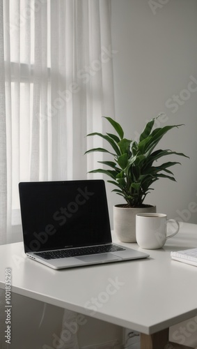 Wallpaper Mural Minimalistic home office setup with open laptop and potted plant Torontodigital.ca