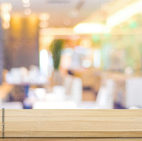 Wallpaper Mural Table and blur restaurant background, Wooden counter cafe over blur bokeh background, Brown wood table top, shelf for food and retail shop, store food and product display banner, mockup, template Torontodigital.ca