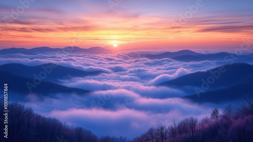 Serene Sunrise Over Mountainous Foggy Landscape