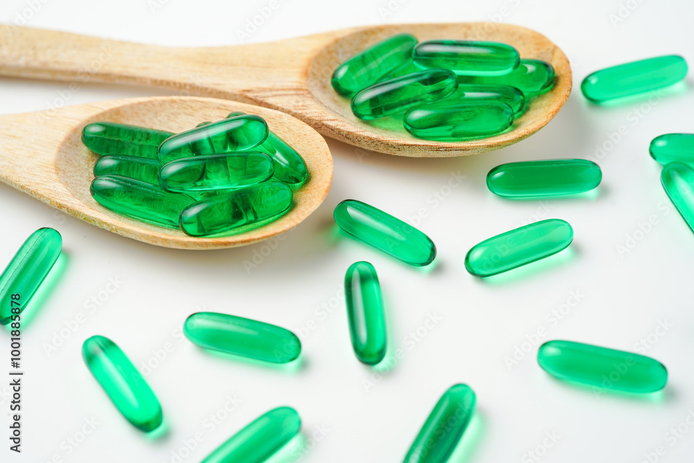 Softgels green, supplements, fish oil, omega 3, vitamin D3, vitamin E oil filled capsules Softgels green, supplements, fish oil, omega 3, vitamin D3, vitamin E oil filled capsules
