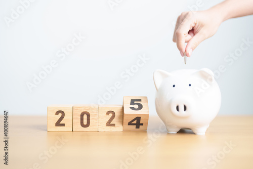 2024 end year to Happy New Year 2025 with piggy bank. Resolution, Goals, Plan, Action, Money Saving, Retirement fund, Pension, Investment and Financial concept photo